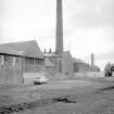 View from NW showing chimney and part of WSW front of factory