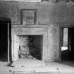 View of gallery showing fireplace and remains of painted decoration
