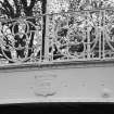 Detail showing cast iron parapet and date plaque.
Insc: '1879'.