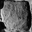 Digital copy of view of symbol stone built into wall, Arndilly