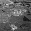 Scanned image of oblique aerial view of Buddon Camp with the early 20th Century gun battery in the foreground.  Also visible is the modern main camp, 19th Century gunnery room and other ancilliary buildings.