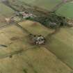 Oblique aerial view of the farmsteadings and country house, taken from the W
