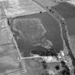 Oblique aerial view centred on the cropmarks of the frost wedge polygons at Backwood Hill, looking to the NNE.