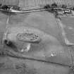 Oblique aerial view centred on the remains of the fort at Green Cairn, Cairnton of Balbegno, looking to the NNW.