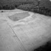 Oblique aerial view centred on the cropmarks of the ring ditch and possible henge at Berryley, looking to the ENE.