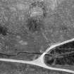 Oblique aerial view centred on the remains of the henge at Wormy Hillock, looking to the NNE.