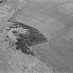 Oblique aerial view centred on the remains of the fort at Cairnmore, looking to the ESE.