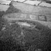 Oblique aerial view centred on the remains of the vitrified fort at Craig Phadrig, looking to the WNW.