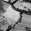 Oblique aerial view centred on the cropmarks of the enclosure at Easter Galcantray, looking to the NNW.