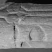 Detail of serpent head on upper surface of recumbent grave-slab, (St Vigeans no.29).