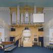 Interior. View from E showing pulpit, communion table and organ
