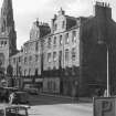 Oblique view of the front facades of No. 1 - 15 Buccleuch Street seen from the South South West with the Buccleuch and Greyfriars Free Church in the background.