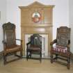 Interior, ground floor, reception room, view of fireplace and oak chairs