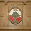 Interior, ground floor, reception room, detail of coat of arms on fireplace