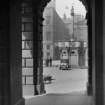 General view of Market Cross through arch in Parliament Square