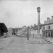 General view of Kincardine, High Street with Market Cross in foreground.
Scanned from glass plate negative. Original envelope annotated by Erskine Beveridge 'Cross Kincardine'