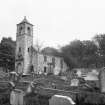 Tulliallan Old Parish Church. 
View of church with graveyard in foreground.
Scanned from glass plate negative. Original envelope annotated by Erskine Beveridge 'Old Tulliallan Ch[urch]'