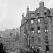 General view of North East side of Candlemaker Row looking towards Cowgate with horse and cart in foreground.