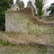 Detail of walling at E end of church from NW.