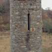 Glenfinnan Monument.  Hi-spy detail of upper window from South West.