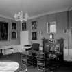 Interior.
View of a room with portraits on wall.