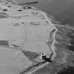 Oblique aerial view of Orkney, Hoy, Crockness Martello Tower, taken from the S.  Also visible is part of the Second World War Rinnigil barrage balloon gas production plant.