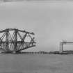 View of the Forth bridge under construction seen from the West.
