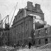 View of central block during demolition of Royal Infirmary, Edinburgh. 
Titled: 'Edinburgh Infirmary'.
