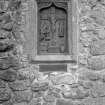 Interior.
Detail of carved panel set in N wall.
