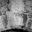 Detail of sculpted stone above the fireplace.