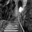 Exterior view of portcullis arch and stairs at Dumbarton Castle.