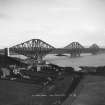 View of the bridge in use seen from the North West.
Insc. 'The Forth Bridge from North West.  177.'
