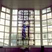 Interior.  Ground floor, entrance hall, detail of stained glass window behind reception desk