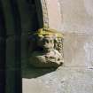 Detail of corbel on hoodmould above main entrance.