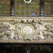 View of carved panel to left of entrance to The Scotsman Hotel, E side of building (North Bridge).