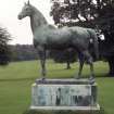 View of sculpture of 'King Tom', to E of Dalmeny House.