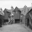 View of White Horse Close East buildings from courtyard.  Negative hand insc:'Whitehorse Close E Buildings Courtyard'.