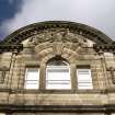 View of carved arms of the Merchant Company, in pediment above top floor windows.