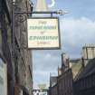 View of shop sign attached to bracket, 197 Canongate.