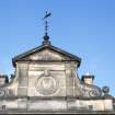 View of coat of arms of the University of Edinburgh, in gable on Drummond Street facade.