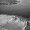 Hoy, Crockness, oblique aerial view, taken from the SW, centred on the Martello Tower and a curving linear soilmark.