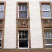 View of panels betwen windows, above entrance to 1940s extension to Leith Hospital Nursing Home (now flats).