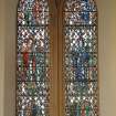 Interior.
View of stained glass window on N wall.