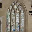 View of stained glass windo in East wall.