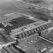 Macfarlane, Lang and Co. Biscuit Factory, Clydeford Drive, Glasgow with the Govancroft Pottery in the background.  Oblique aerial photograph taken facing south.