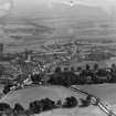 Falkland, general view, showing Falkland Palace and Scottish Co-operative Wholesale Society Ltd. Floorcloth and Linoleum Factory, St John's Works.  Oblique aerial photograph taken facing east.