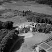 Knockbrex and Stable House, Knockbrex Bay.  Oblique aerial photograph taken facing west.