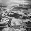 Balmoral Castle and Crathie Burn, Balmoral Estate.  Oblique aerial photograph taken facing south.