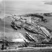 Tilbury Contracting and Dredging Co. Ltd. Quarry and Thomas Ward and Sons Shipbreaking Yard, Inverkeithing.  Oblique aerial photograph taken facing south-east.  This image has been produced from a damaged and crop marked negative.
