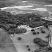 Kiloran, general view, showing Colonsay House and Loch Fada.  Oblique aerial photograph taken facing south.  This image has been produced from a crop marked negative.